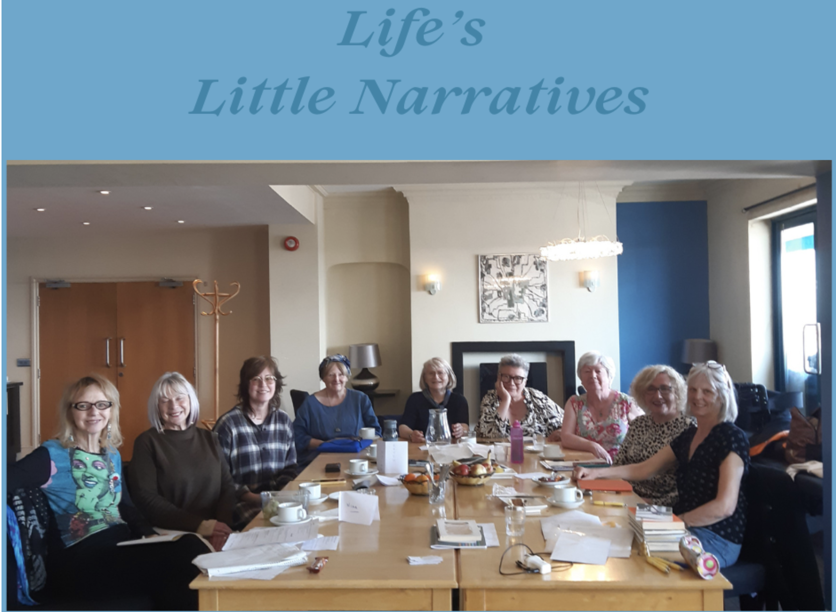 A Life's Little Narratives group gathered around a long table